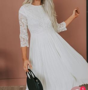 Ivory lace dress with pleated skirt